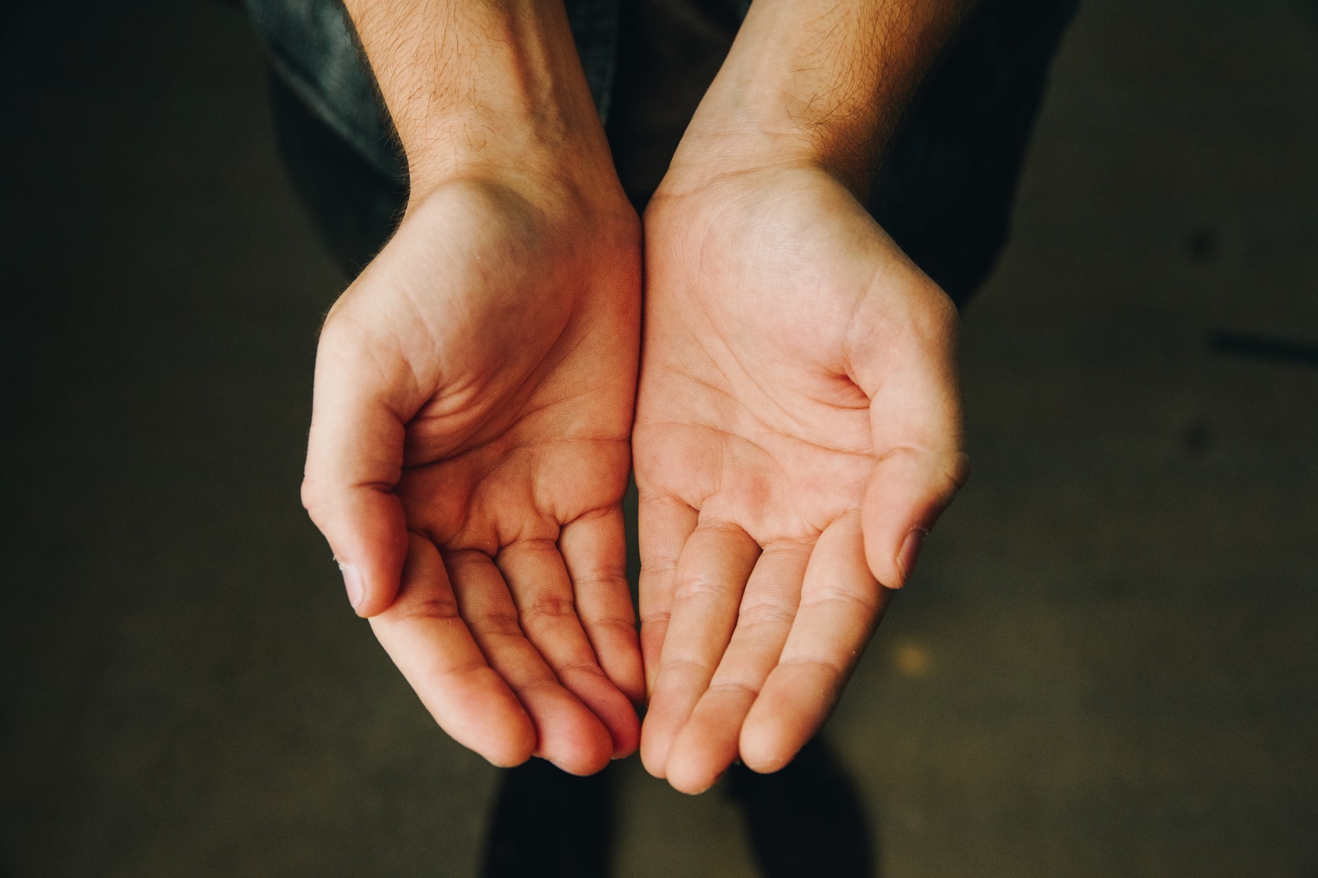 a man holding out his hands